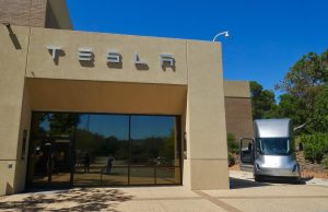 Tesla Kicks Off Semi Volume Production April 2026 Tesla Semi electric truck parked outside Giga Nevada factory, ready for freight transport